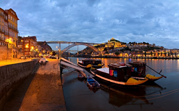 Visit-Portugal-panorama-old-Porto-river-Duoro-Vintage-Port-Transporting-Boats-Old-Town-Town-of-Gaia-and-Famous-Bridge-Ponte-Dom-Luis